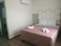 Posteľ alebo postele v izbe v ubytovaní Amalia Deluxe Villas