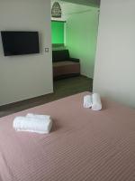 Posteľ alebo postele v izbe v ubytovaní Amalia Deluxe Villas