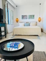 Łóżko lub łóżka w pokoju w obiekcie Portobello Boutique Hotel