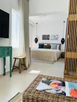 Łóżko lub łóżka w pokoju w obiekcie Portobello Boutique Hotel