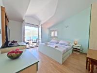 Postel nebo postele na pokoji v ubytování Rooms and Apartments Porat