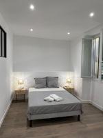 Łóżko lub łóżka w pokoju w obiekcie Appartement T2 vieille ville d’Ajaccio