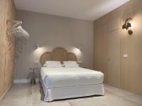 Łóżko lub łóżka w pokoju w obiekcie VIDAL APARTAMENTOS con parking privado.