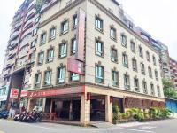 a large building on the corner of a street at Ashare Hotel in Jiaoxi