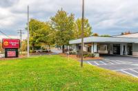 a building with a parking lot in front of it at Clarion Inn Belle Vernon in Belle Vernon