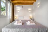 Łóżko lub łóżka w pokoju w obiekcie Anius Apartments