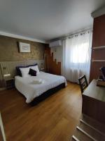 Łóżko lub łóżka w pokoju w obiekcie Hôtel Influences La Bresse