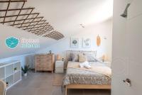 A bed or beds in a room at SkySea Holidays CITY CENTER SUITES