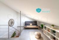 A bed or beds in a room at SkySea Holidays CITY CENTER SUITES