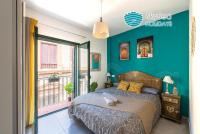 A bed or beds in a room at SkySea Holidays CITY CENTER SUITES