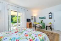 Televízia a/alebo spoločenská miestnosť v ubytovaní Apartments Adri