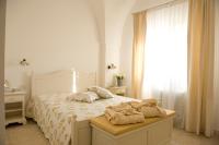 A bed or beds in a room at Masseria Bianca di Puglia