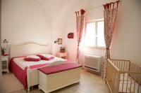 A bed or beds in a room at Masseria Bianca di Puglia