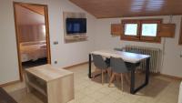 A television and/or entertainment centre at Hostal La Cabanya