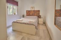 A bed or beds in a room at Two Bedrooms Leonor Davalos 2