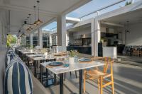 a dining room with a long table and chairs at Meliá Phuket Mai Khao in Mai Khao Beach
