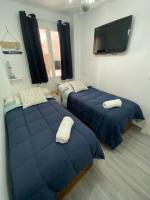 Postel nebo postele na pokoji v ubytování Molineros Victoria Beach