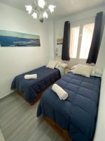 Postel nebo postele na pokoji v ubytování Molineros Victoria Beach