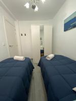 Postel nebo postele na pokoji v ubytování Molineros Victoria Beach