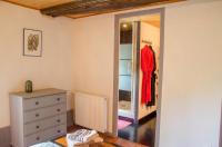 a bedroom with a dresser and a mirror at La Pause Céleste in Ordonnac