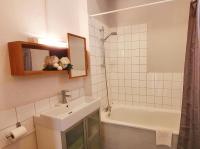 a white bathroom with a sink and a shower at VIEUX LILLE Porte de Gand Bienvenue chez NESTYOU, Lille in Lille