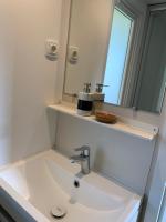 a bathroom with a sink and a mirror at Chalet Max II in Helming
