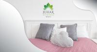 Łóżko lub łóżka w pokoju w obiekcie Juhar Apartman