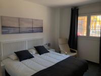 A bed or beds in a room at La Casita
