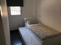 A bed or beds in a room at La Casita