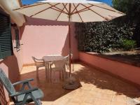 A patio or other outdoor area at LENTISCHIO villetta vista mare a 250 metri dalla spiaggia con ARIA CONDIZIONATA