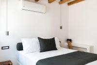 Posteľ alebo postele v izbe v ubytovaní Ryous Mykonos