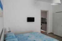 Telewizja i/lub zestaw kina domowego w obiekcie Damy Sea House