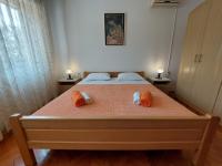 Łóżko lub łóżka w pokoju w obiekcie Apartment Marohnić