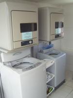 a laundry room with washers and dryers in it at Hotel Purity in Xinzhuang