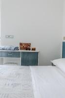 A bed or beds in a room at Hotel Lucerna