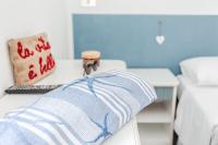 A bed or beds in a room at Hotel Lucerna