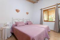 Postel nebo postele na pokoji v ubytování YourHouse Sa Sini villa