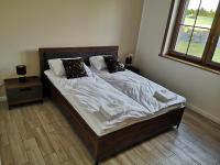 Posteľ alebo postele v izbe v ubytovaní Apartamenty, Zielone Wzgórze Wiktora w Mikołajkach