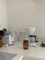 a kitchen counter with a coffee maker and a toaster at Lou Mut in Lectoure