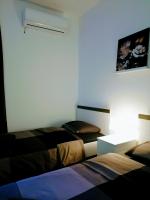Posteľ alebo postele v izbe v ubytovaní zPula Center Studio Apartments
