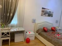 A bed or beds in a room at Casa di Taty B&B