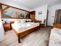 Postel nebo postele na pokoji v ubytování PENSION POD SKALOU