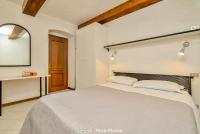 A bed or beds in a room at Ca da Derna