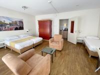 Een bed of bedden in een kamer bij Hotel Residence Le Coin