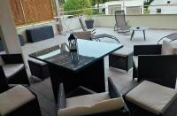 a patio with a table and chairs on a patio at Casa Balanina in Lumio