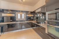 Kuchyň nebo kuchyňský kout v ubytování VESTA - El Gouna Residence
