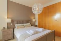 A bed or beds in a room at C43 - Family House with Terrace and Shared Pool