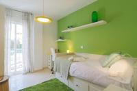 A bed or beds in a room at C43 - Family House with Terrace and Shared Pool