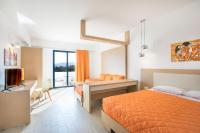 Postel nebo postele na pokoji v ubytování Ekaterini Hotel