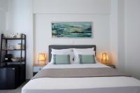 Posteľ alebo postele v izbe v ubytovaní ALMYRA seafront residence